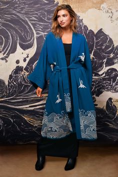 This deep teal coloured fully lined kimono is a statement piece. Inspired by Hokusai the hem features embroidered ivory waves. The upper part features embroidered ivory origami birds. The belt has embroidery detail on the tails.  Style this with jeans, shorts or over a dress or wear as a robe around the house. This kimono is super versatile to add endless style to any outfit. The outer fabric and lining are 100% Viscose.  Dry clean only. Blue Origami, Origami Birds, Stocking Fillers For Her, Long Kimono, Jewelry Ring Box, Deep Teal, Teal Colors, Embroidery Details, Independent Designers Fashion