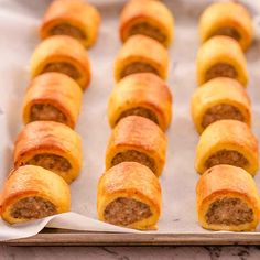 there are many sausage rolls on the baking sheet