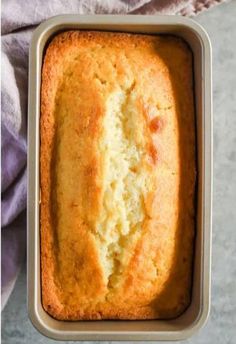 a loaf of bread sitting in a pan on top of a table