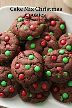 chocolate christmas cookies on a plate with green and red sprinkles in the middle