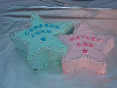 two cakes decorated to look like stars with name written on them