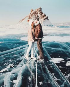 two people standing on an ice covered lake