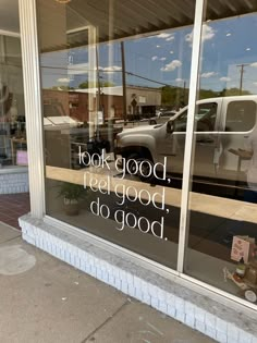 there is a truck in the window that says look good, eat good, do good