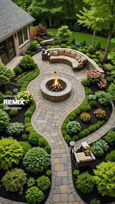 an outdoor fire pit surrounded by landscaping