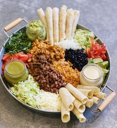 a plate filled with lots of different foods and condiments on top of it