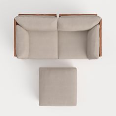 an overhead view of a couch and ottoman