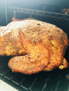 a roasting chicken is being cooked in an oven