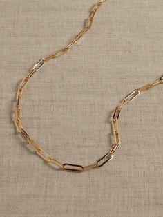 This delicate yet contemporary elongated paperclip chain is perfect for a necklace stack.  Timeless Classics: Luxury, everyday.  A showcase of time-honored craftsmanship and skilled Italian artisans, these are the pieces you'll reach for season after season, delighting in their exceptional versatility and endless appeal.  Lobster clasp.  12K-gold plated or silver-plated bronze.  Made in Italy.  Length: 20" Necklace Stack, Paperclip Chain Necklace, Paperclip Necklace, Paper Chains, Gold Paper, Women's Jewelry And Accessories, Accessories Jewelry Necklace, Gold Filled Chain, Paper Clip