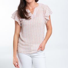 The Petra Ruffle Sleeve Blouse is stunning in a soft, peony floral with gorgeous ruffle sleeves, smocking at the shoulder, and classic v-neck collar. Lightweight and easy to wear with anything in your closet, this top is an absolute spring essential. Our simple blouse is made from lightweight and breathable fabric with smooth soft feeling, providing this t-shirt for women a skin-friendly feel with noticeable softness. This fun short sleeve shirt is casual, chic and will never go out of style, th Spring Essentials, Soft Feeling, Simple Blouse, Ruffle Sleeve Blouse, Ruffle Shorts, Ruffle Sleeves, T Shirt For Women, V Neck Blouse, Neck Collar