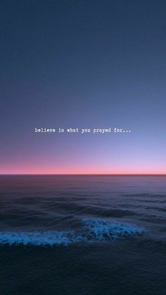 an ocean with the words believe in what you prepared for on it at night time