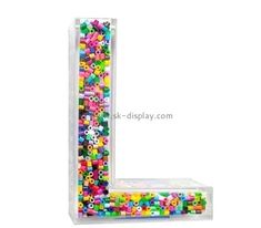 the letter l is made out of colorful beads and plasticine letters with numbers on them