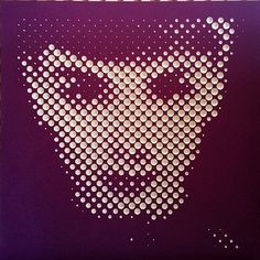 an image of a face made out of circles on a purple background with white dots