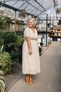 Discover the effortless elegance of the Genevieve Midi. With a cream base and light brown geometric stripes, this dress is sure to turn heads. The v-neck and short puff sleeves add to the smocked elastic waistline and pockets that provide comfort and convenience. Model is wearing a large and is 5'5". Plus model is wearing a 1X and is 5'7". Size Chart Length Bust Waist S 47" 32" 28" M 47" 35" 30" L 48" 38" 32" XL 48.5" 40" 34" 1x 50" 42" 36" 2x 50.5" 46" 40" 3x 50.5" 49" 42" *Measurements are app Tiered Dresses, Plus Model, Teen Dress, Cream Base, Color Crema, White Outfits, Floral Maxi Dress, Jeans Dress, Puff Sleeves