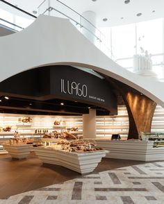 the interior of a deli with food on display