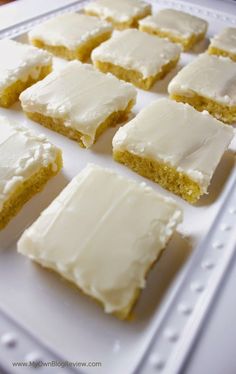 several pieces of cake sitting on top of a white tray