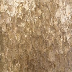 an abstract textured wall with gold paint