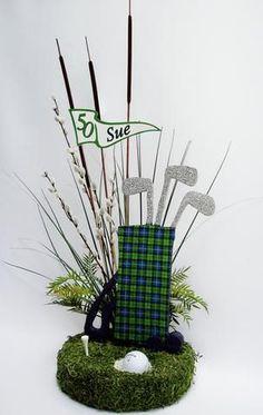 a golf themed arrangement with tees and bags