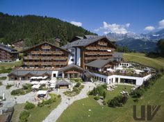 an aerial view of a hotel in the mountains