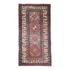 an antique persian rug with geometric design