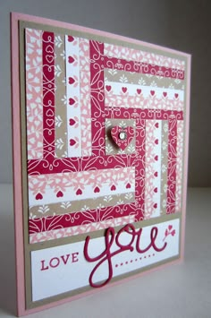 a close up of a card with the words love you on it and a heart