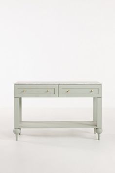 a white table with two drawers on it