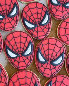 spiderman cookies are arranged on a table