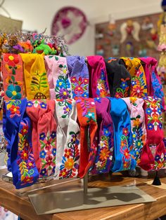 many colorful ties are on display in a store