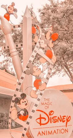 an animation sign with mickey mouses on it