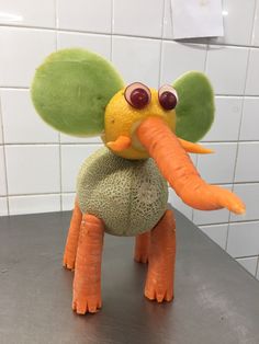 an elephant made out of melon and carrots