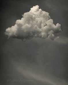 a black and white photo of a cloud in the sky