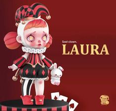 a doll with red hair and white makeup is standing on a table next to cards