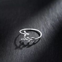 2 for £10 on all essential collection items! Adjustable silver ring in a circling leaf design. Basic Silver Rings, Minimal Silver Ring, Olive Leaf Ring, Plant Rings, Minimalist Silver Ring, Silver Leaf Ring, Huggie Earrings Silver, Minimal Ring, Silver Ring Designs