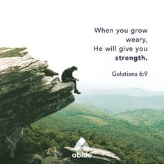 a man sitting on top of a cliff with a bible verse above him that reads, when you grow weary, he will give you strength