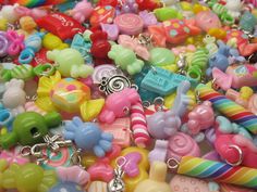 "Candy Charm Mix: ever-evolving selection of cute candy charms! choose from 25 or 50 pieces Please take a look at the photos of charms on an adult hand for size reference. This Candy Charm Mix is a varied selection of a candy charms (chocolate, lollipops, hard candy, gummy bears, candy canes and other sweets.) You may receive varied styles of charms made from plastic, acrylic, resin, and metal. Some items are manufactured as charms, and others have been modified by me so that they can hang as ch Candy Gummy, Candy Charms, Kawaii Charms, Food Kawaii, Diy Kandi, Animal Food, Candy Bracelet, Chocolate Lollipops, Candy Jewelry