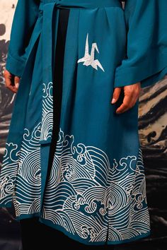 This deep teal coloured fully lined kimono is a statement piece. Inspired by Hokusai the hem features embroidered ivory waves. The upper part features embroidered ivory origami birds. The belt has embroidery detail on the tails.  Style this with jeans, shorts or over a dress or wear as a robe around the house. This kimono is super versatile to add endless style to any outfit. The outer fabric and lining are 100% Viscose.  Dry clean only. Blue Origami, Origami Birds, Origami Bird, Stocking Fillers For Her, Long Kimono, Jewelry Ring Box, Deep Teal, Teal Colors, Embroidery Details