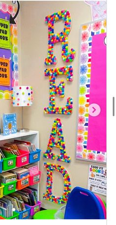 this classroom is decorated with colorful letters and plastic bins