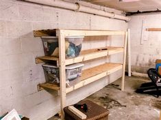 an unfinished room with shelves and baskets on the floor