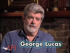 an older man is sitting in front of a fireplace with the words george lucas on it