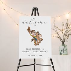 a welcome sign with a cartoon monkey holding a baseball bat in his hand and the words,'welcome to cameron's first birthday'on it