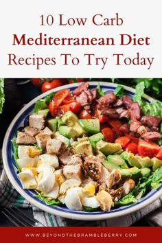 a salad with meat, tomatoes and avocado on it in a blue and white bowl