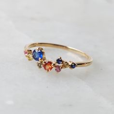 **KINDLY CHECK OUT THE VIDEO OF THE ITEM FOR A CLEARER VIEW** Details of the ring: Gem: Multi Sapphire Gem shape and size: --ROUND- 3.00 MM-1 PC --ROUND- 2.50 MM-1 PC --ROUND- 1.50 MM-7 PC Gem weight: 0.35 carats Gold purity: 14K (58.33% approx.) Gold weight: 1.30 gms Total weight of ring: 1.37 gms Natural Multi Sapphire ring set in solid 14K yellow gold. The Gold purity is guaranteed and it comes with authentic 14 kt gold hallmark. Since these Rings are handmade, Size Customization is available 14k Gold Multi-stone Sapphire Promise Ring, Fine Jewelry Cluster Ring With Multi-stones For Gifts, Fine Jewelry Multi-stone Cluster Ring Gift, Sapphire Multi-stone Cluster Ring Gift, Sapphire Multi-stone Cluster Ring As A Gift, 14k Gold Cluster Ring With Gemstone Accents As Gift, Unique Multi-stone Sapphire Promise Ring, Multi-stone Cluster Birthstone Ring Gift, Cluster Multi-stone Birthstone Ring As Gift