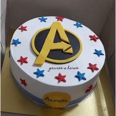 a birthday cake with the letter a on it and red, white, and blue stars