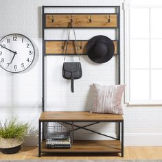 a room with a clock, coat rack and other items