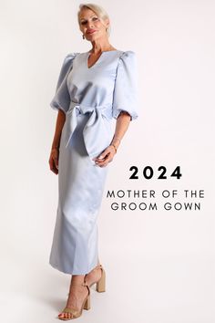 a woman in a blue dress with the words, mother of the groom