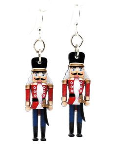 a pair of nutcrackers are hanging from earrings