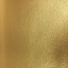 a gold metallic textured background that looks like it has been painted