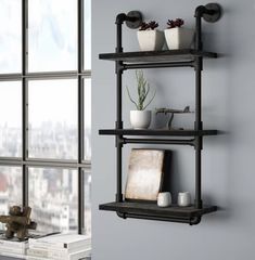 a shelf with pots and plants on it in front of a window overlooking the city