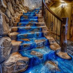 a staircase with blue water flowing down it