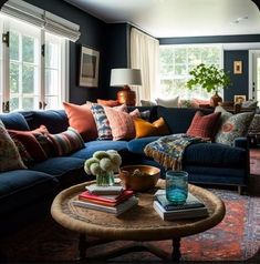 a living room filled with lots of furniture and pillows on top of a coffee table