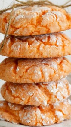 a stack of cookies with powdered sugar on top